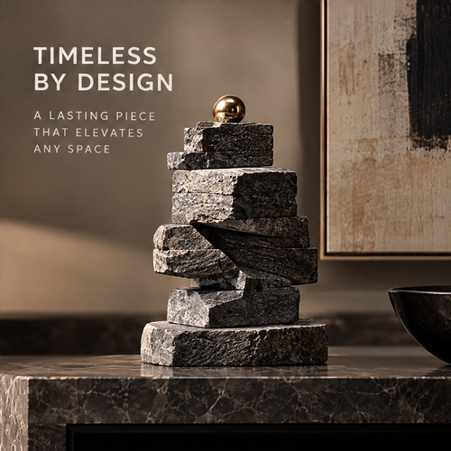 Charcoal-gray stacked tower sculpture topped with a gold-tone orb, without text